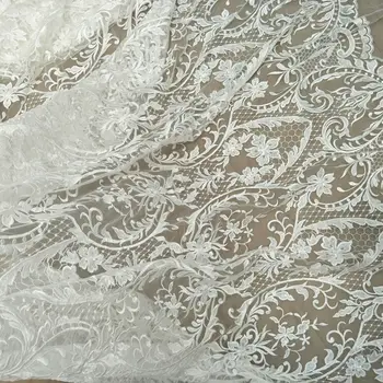 Ново красива снежна сватбена рокля от плат дантела с пайети ширина 130 см, се продава на по размер